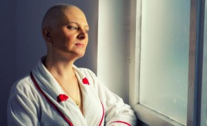 Bald woman cancer patient in the hospital